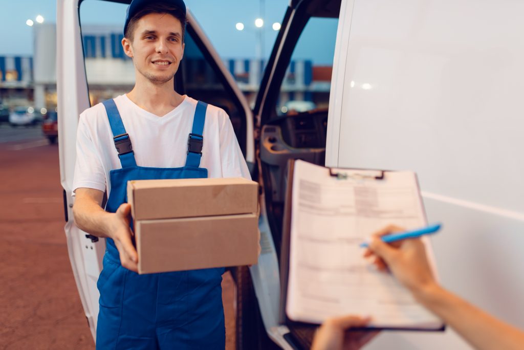 deliveryman-gives-parcel-to-female-recipient-2021-08-27-10-00-37-utc-1024x684